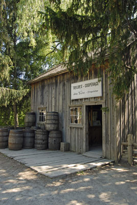 barrels are stacked outside the cooperage in Black Creek Pioneer Village
