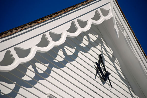 detail of wood trim on eaves of the tinsmith shop
