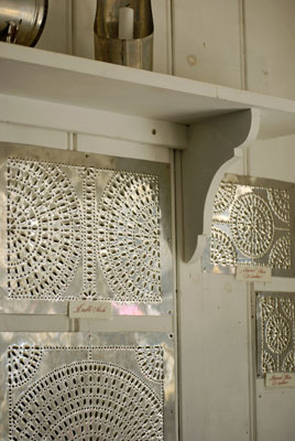 samples of the tinsmith’s work hang on the shop wall