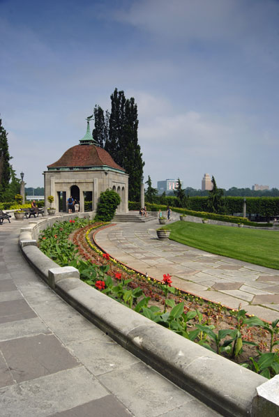 the curve of the amphitheatre towards one of the stone pavilions is accentuated with a bright floral border